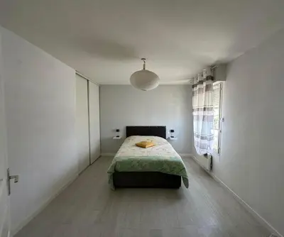 Un ou plusieurs lits dans un hébergement de l'établissement Charmante maison comme chez soi