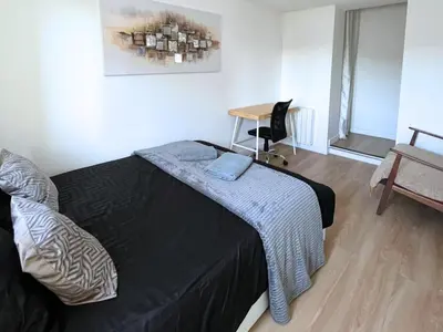Un ou plusieurs lits dans un hébergement de l'établissement SQ Appartement - 2 Chambres - Proche Gare - Wi-Fi