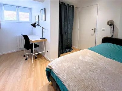 Un ou plusieurs lits dans un hébergement de l'établissement SQ Appart City - 1 Chambre - 5 Pers