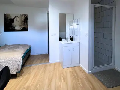Un ou plusieurs lits dans un hébergement de l'établissement SQ Appart City - 1 Chambre - 5 Pers