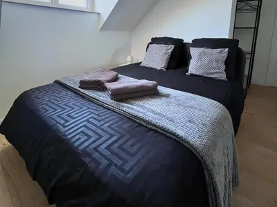 Un ou plusieurs lits dans un hébergement de l'établissement SQ Appart élégance - Appartement 1 Chambre - Gare St Quentin - Parking