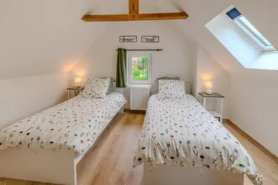 Un ou plusieurs lits dans un hébergement de l'établissement La Maissemiacoise - Belle Maison de campagne