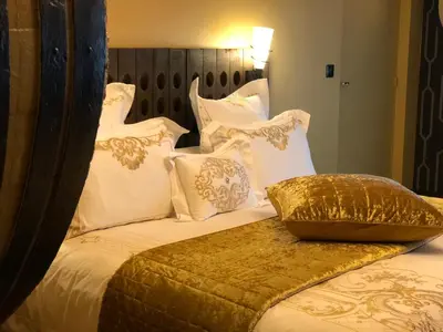 Un ou plusieurs lits dans un hébergement de l'établissement La suite des Chapitres en Champagne
