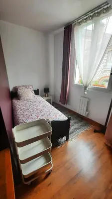 Un ou plusieurs lits dans un hébergement de l'établissement Chambre cosy