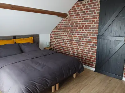 Un ou plusieurs lits dans un hébergement de l'établissement Au 112, maison d'hôtes meublée