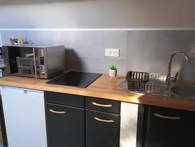 Cuisine ou kitchenette dans l'établissement Au 112, maison d'hôtes meublée