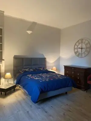 Un ou plusieurs lits dans un hébergement de l'établissement Appartement Brasserie du Jard 2 chambres