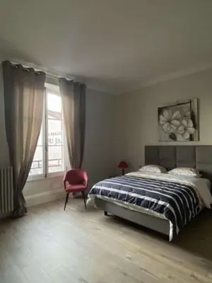 Un ou plusieurs lits dans un hébergement de l'établissement Appartement Brasserie du Jard 2 chambres