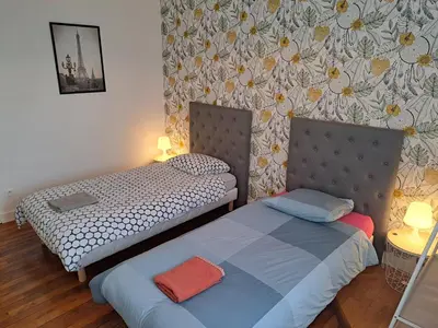 Un ou plusieurs lits dans un hébergement de l'établissement Chez Léon - Vue cathédrale - Hyper centre ville