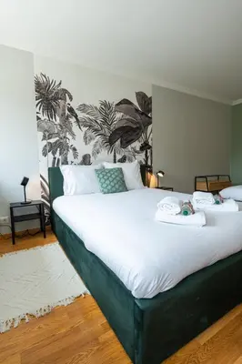 Un ou plusieurs lits dans un hébergement de l'établissement Évasion à Oiry Villa Madeline