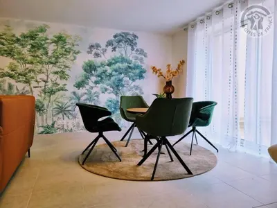 Coin salon dans l'établissement Gîte chaleureux avec WIFI et grand jardin, près de Disneyland - FR-1-532-22