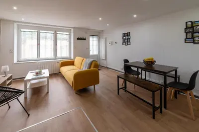 Coin salon dans l'établissement Charmante maison au calme avec terrasse & parking