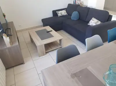 Coin salon dans l'établissement Maison pour 4 à 8 personnes à 15 min de Disney