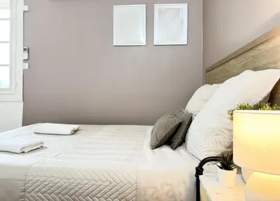 Un ou plusieurs lits dans un hébergement de l'établissement Studio Platanes 3 - Proche Disneyland - Parking gratuit - Meaux