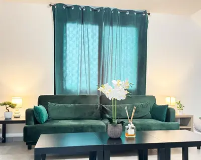 Coin salon dans l'établissement Appartement Platanes 7 - Proche Disneyland - Parking Gratuit - Meaux