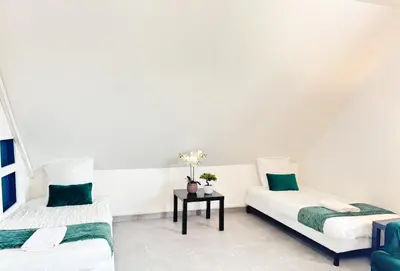 Un ou plusieurs lits dans un hébergement de l'établissement Appartement Platanes 7 - Proche Disneyland - Parking Gratuit - Meaux