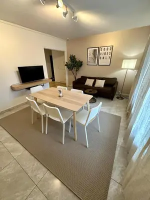 Télévision ou salle de divertissement dans l'établissement Au Coeur du Quartier Taittinger
