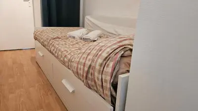 Un ou plusieurs lits dans un hébergement de l'établissement Studio New York hypercentre Reims