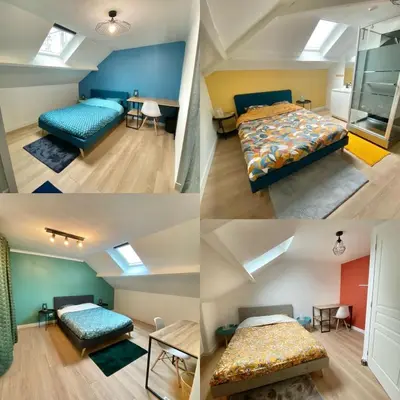 Un ou plusieurs lits dans un hébergement de l'établissement Belle appartement 4 chambres
