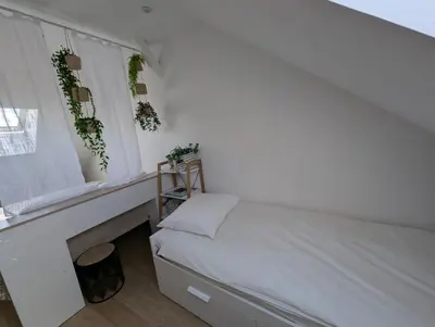 Un ou plusieurs lits dans un hébergement de l'établissement Duplex77 with garage Near Disney