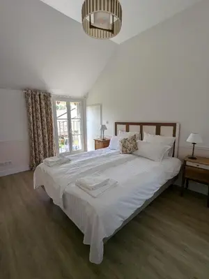 Un ou plusieurs lits dans un hébergement de l'établissement La Maison Cornon