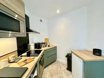 Cuisine ou kitchenette dans l'établissement Au Mélo' - Proche Gare & Centre