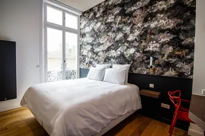 Un ou plusieurs lits dans un hébergement de l'établissement La Rêverie - Deluxe Apartment - SPA - Place du Forum