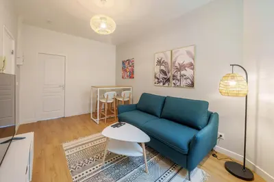 Coin salon dans l'établissement Appartement cosy proche de la gare