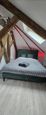 Un ou plusieurs lits dans un hébergement de l'établissement Studio cosy proche centre-ville