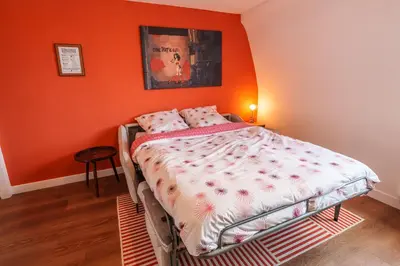 Un ou plusieurs lits dans un hébergement de l'établissement Appartement Tout Confort à Deux Pas de la Gare