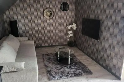 Télévision ou salle de divertissement dans l'établissement Logement Cosy type Loft près de Saint Quentin