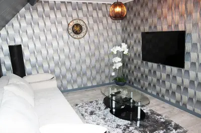 Télévision ou salle de divertissement dans l'établissement Logement Cosy type Loft près de Saint Quentin