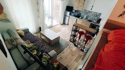 Télévision ou salle de divertissement dans l'établissement Petit Chalet