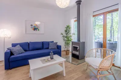 Coin salon dans l'établissement Les Charmes C10 - Le Val Joly