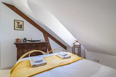 Un ou plusieurs lits dans un hébergement de l'établissement Clocher de la Cathedrale de Reims