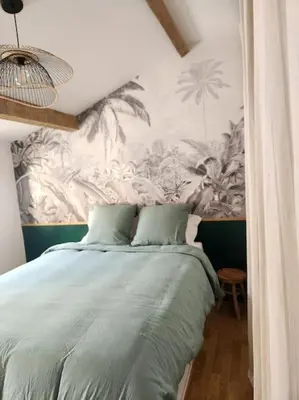 Un ou plusieurs lits dans un hébergement de l'établissement Le Garden Champ'- Duplex, jardin