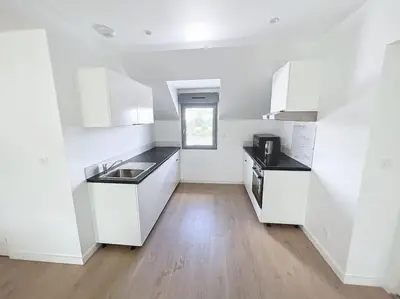 Cuisine ou kitchenette dans l'établissement Appartement neuf proche gare