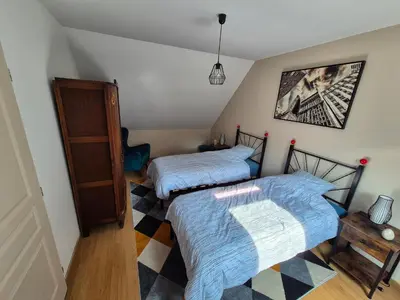 Un ou plusieurs lits dans un hébergement de l'établissement Clamecy Maison La Campagnarde