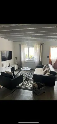 Coin salon dans l'établissement Maison de village