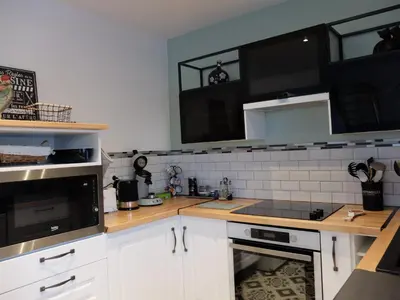 Cuisine ou kitchenette dans l'établissement Gîte coté Jardin