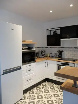 Cuisine ou kitchenette dans l'établissement Gîte coté Jardin