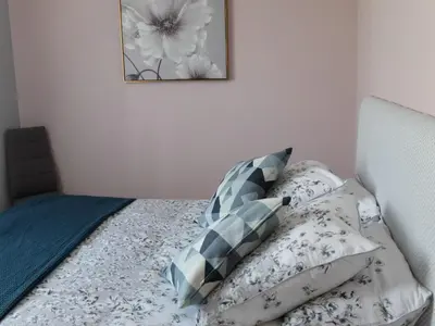 Un ou plusieurs lits dans un hébergement de l'établissement Gîte coté Jardin
