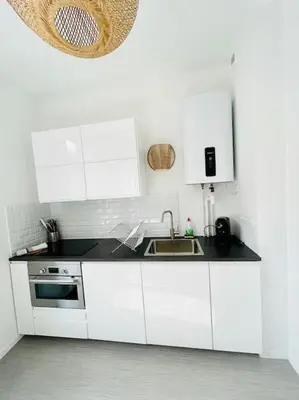 Cuisine ou kitchenette dans l'établissement Appartement Lumineux & Confortable