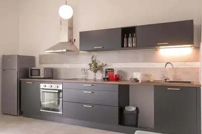 Cuisine ou kitchenette dans l'établissement Résidence appartement proche Disneyland