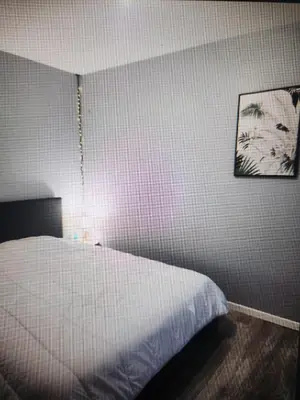 Un ou plusieurs lits dans un hébergement de l'établissement RDC 1 chambre-centre-ville-terrasse