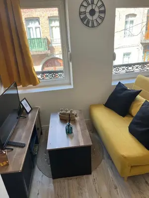 Coin salon dans l'établissement Appartements Avesnes sur Helpe Cosy T2