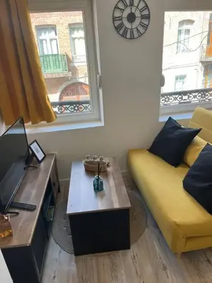 Coin salon dans l'établissement Appartements Avesnes sur Helpe Cosy T2