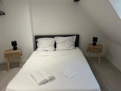 Un ou plusieurs lits dans un hébergement de l'établissement Appartements Avesnes sur Helpe Cosy T2