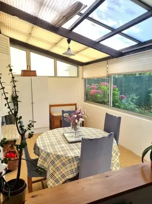 Coin salon dans l'établissement Maison chaleureuse près Disney