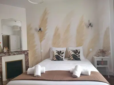 Un ou plusieurs lits dans un hébergement de l'établissement Maison chaleureuse près Disney